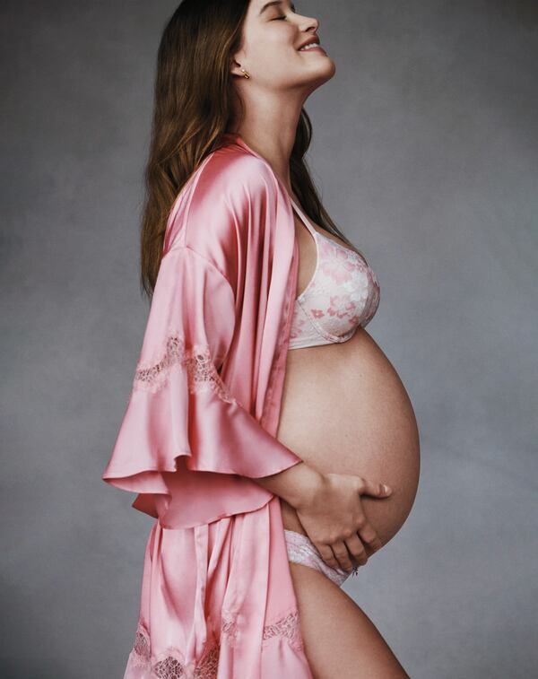 A photo provided by Victoria’s Secret shows a pregnant model, part of the company’s Mother’s Day advertising campaign in May 2021. The embattled lingerie giant is attempting the most extreme brand turnaround in recent memory: an effort not just to redefine itself but also the very idea of what “sexy” is. (Cass Bird/Victoria’s Secret via The New York Times)  