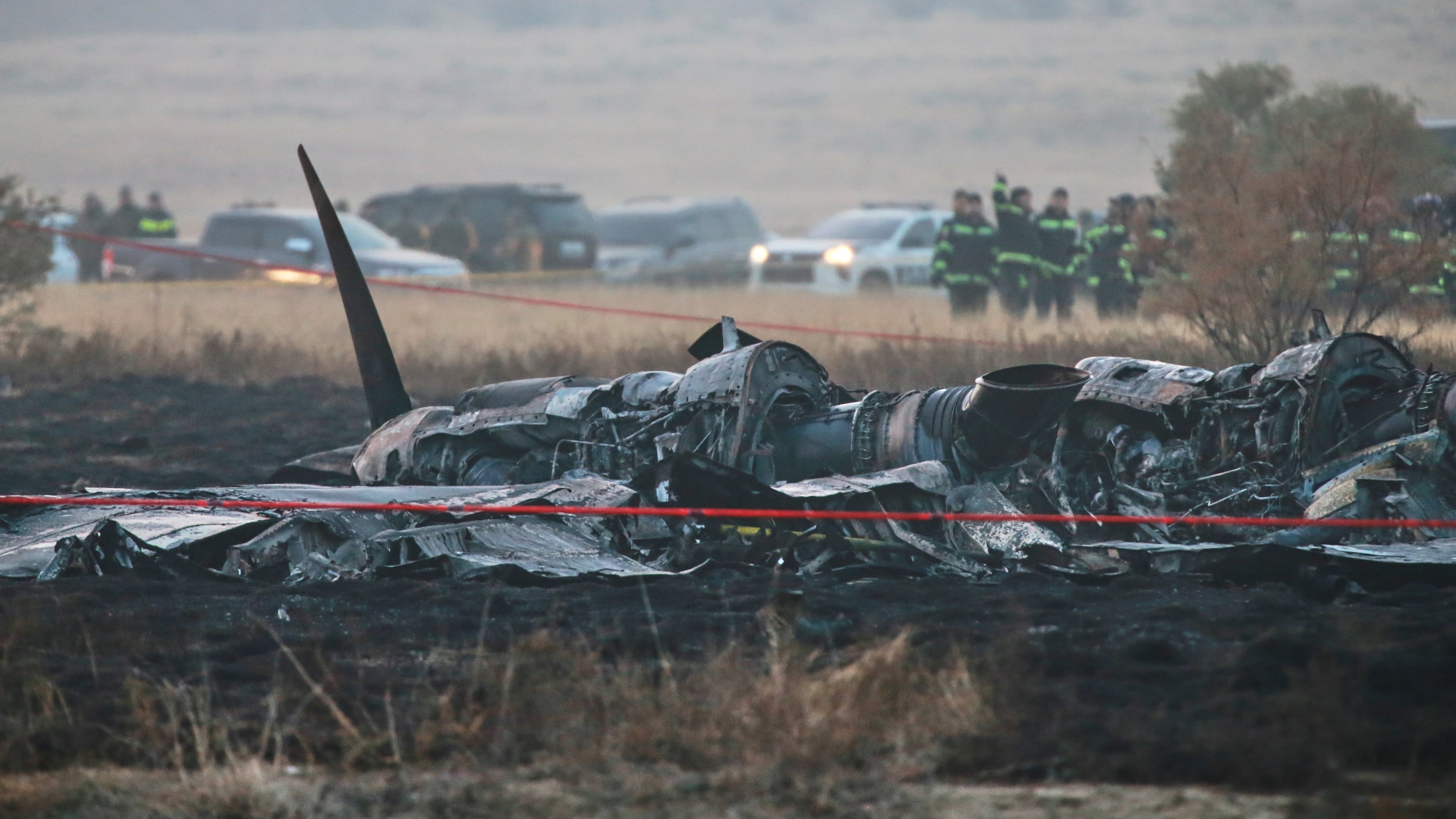 Debris is seen at a crash site of a Turkish military cargo plane in Georgia's Sighnaghi municipality, close to the Azerbaijani border on Wednesday, Nov. 12, 2025. (AP Photo/Zurab Tsertsvadze)