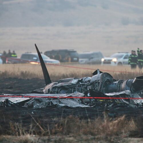 Debris is seen at a crash site of a Turkish military cargo plane in Georgia's Sighnaghi municipality, close to the Azerbaijani border on Wednesday, Nov. 12, 2025. (AP Photo/Zurab Tsertsvadze)
