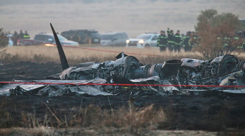 Debris is seen at a crash site of a Turkish military cargo plane in Georgia's Sighnaghi municipality, close to the Azerbaijani border on Wednesday, Nov. 12, 2025. (AP Photo/Zurab Tsertsvadze)
