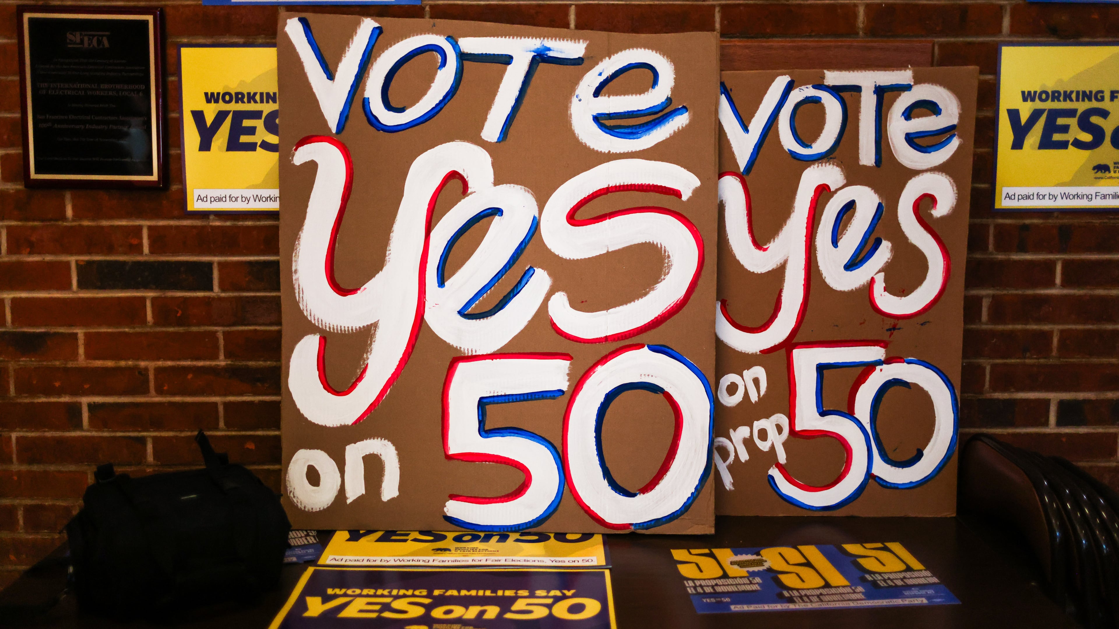Posters at the IBEW Local 6 headquarters ahead of a campaign event in support of Proposition 50 in San Francisco, Monday, Nov. 3, 2025. (Gabrielle Lurie/San Francisco Chronicle via AP)
