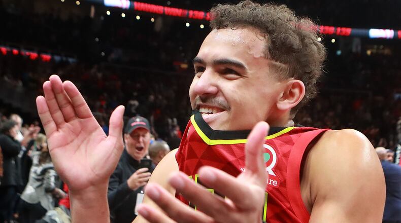 Atlanta Hawks guard Trae Young applaudes the fans after he hit the game winning shot in overtime against the Milwaukee Bucks in a NBA basketball game on Sunday, March 31, 2019, in Atlanta. Curtis Compton/ccompton@ajc.com