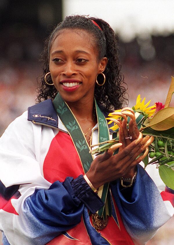 Gail Devers had long finger nails at her gold medal ceremony for winning in the 100-meter competition. (Jonathan Newton/AJC 1996)