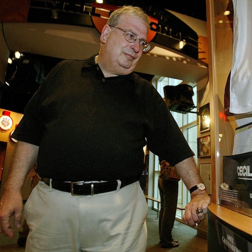 FILE - Philadelphia Inquirer sportswriter Mel Greenberg looks at a display honoring him during a tour of the Women's Basketball Hall of Fame, Friday, June 8, 2007, in Knoxville, Tenn. (AP Photo/Wade Payne, File)