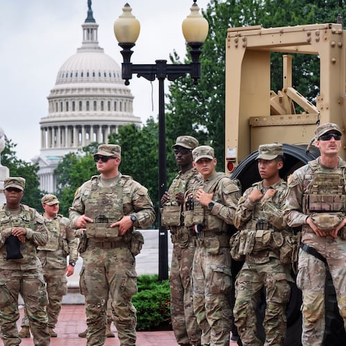 FILE - National Guard troops congregate at the entrance to Union Station in Washington, Aug. 20, 2025. (AP Photo/J. Scott Applewhite, FIle)