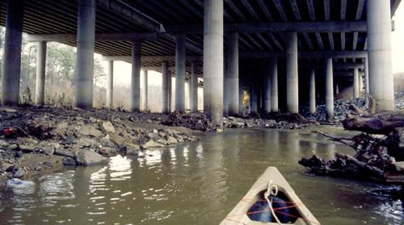 David Kaufman's canoe navigates the North Fork under I-85 near Cheshire Bridge Road.