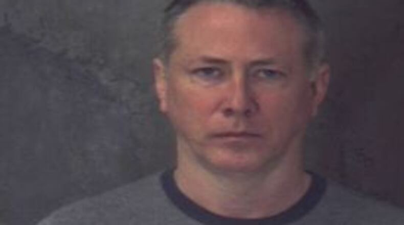 DeKalb County Jail booking photo of Officer Robert Olsen, released on bond Friday morning.