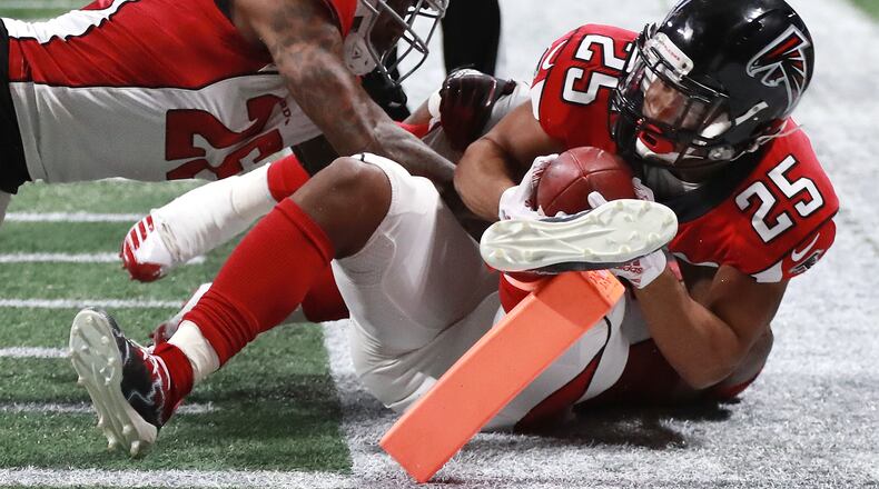 Falcons running back Ito Smith is stopped just short of the endzone by Cardinals Brandon Williams during the first half in a NFL football game on Sunday, Dec 16, 2018, in Atlanta. Curtis Compton/ccompton@ajc.com