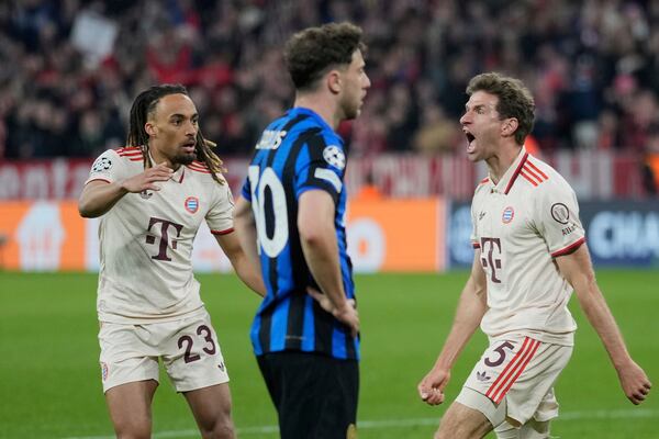Bayern's Thomas Mueller, right, celebrates after scoring his side's opening goal during the Champions League quarterfinals first leg soccer match between FC Bayern Munich and Inter Milan, at the Allianz Arena in Munich, Germany, Tuesday, April 8, 2025. (AP Photo/Matthias Schrader)