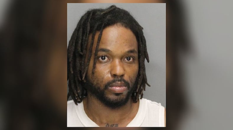 Ulysses Grant Gatling III, 31, is accused of killing a woman inside a Cobb County hotel, according to police.