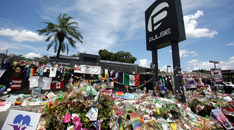 This July 11, 2016, file photo shows a makeshift memorial outside the Pulse nightclub in Orlando, Fla., one month after the shooting that killed 49 people.