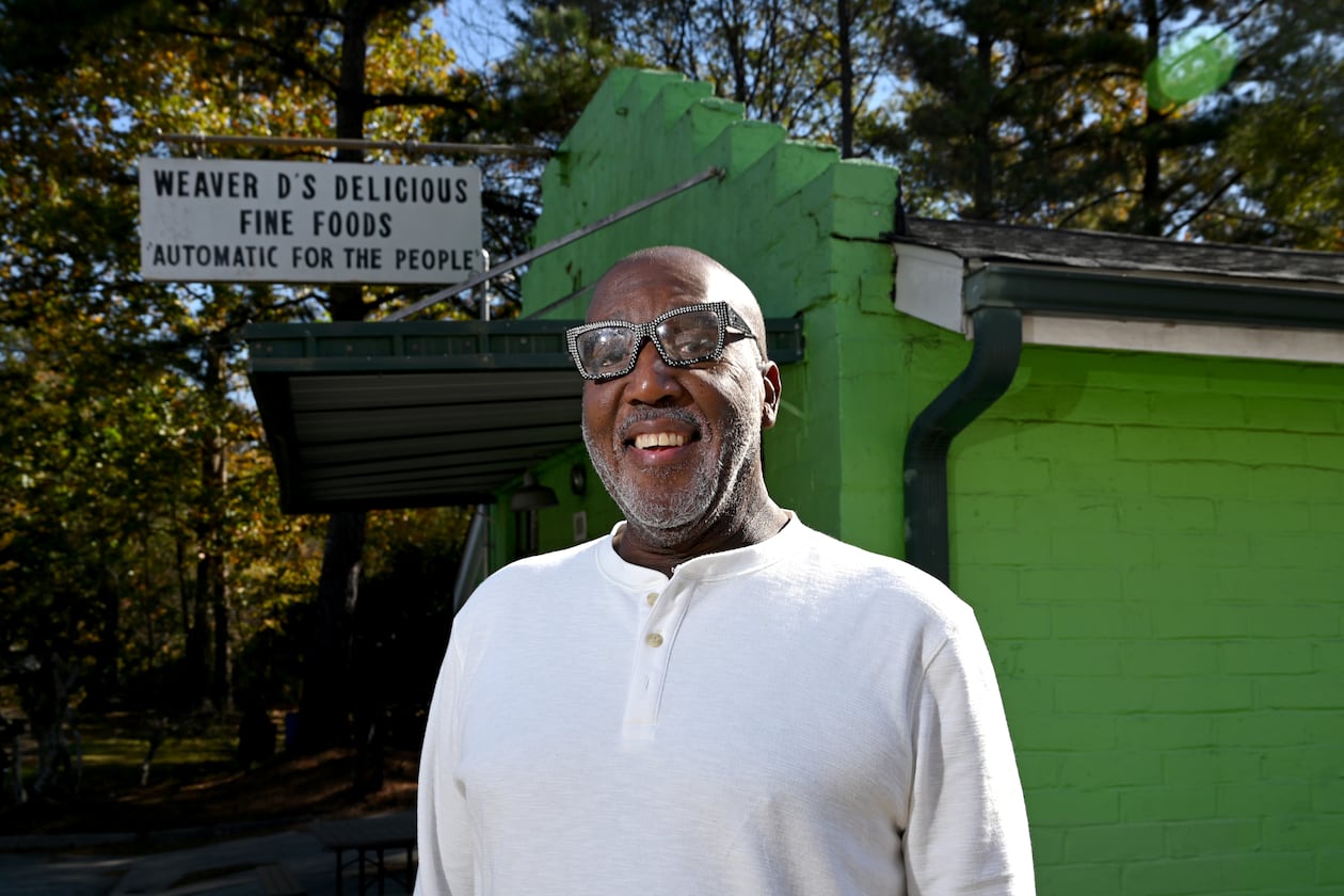 Dexter Weaver, owner of Weaver D’s Delicious Fine Foods, stands outside his restaurant on Wednesday, Nov. 12, 2025. Weaver has put the iconic Athens eatery up for sale, 39 years after he opened it. (Hyosub Shin/AJC)
