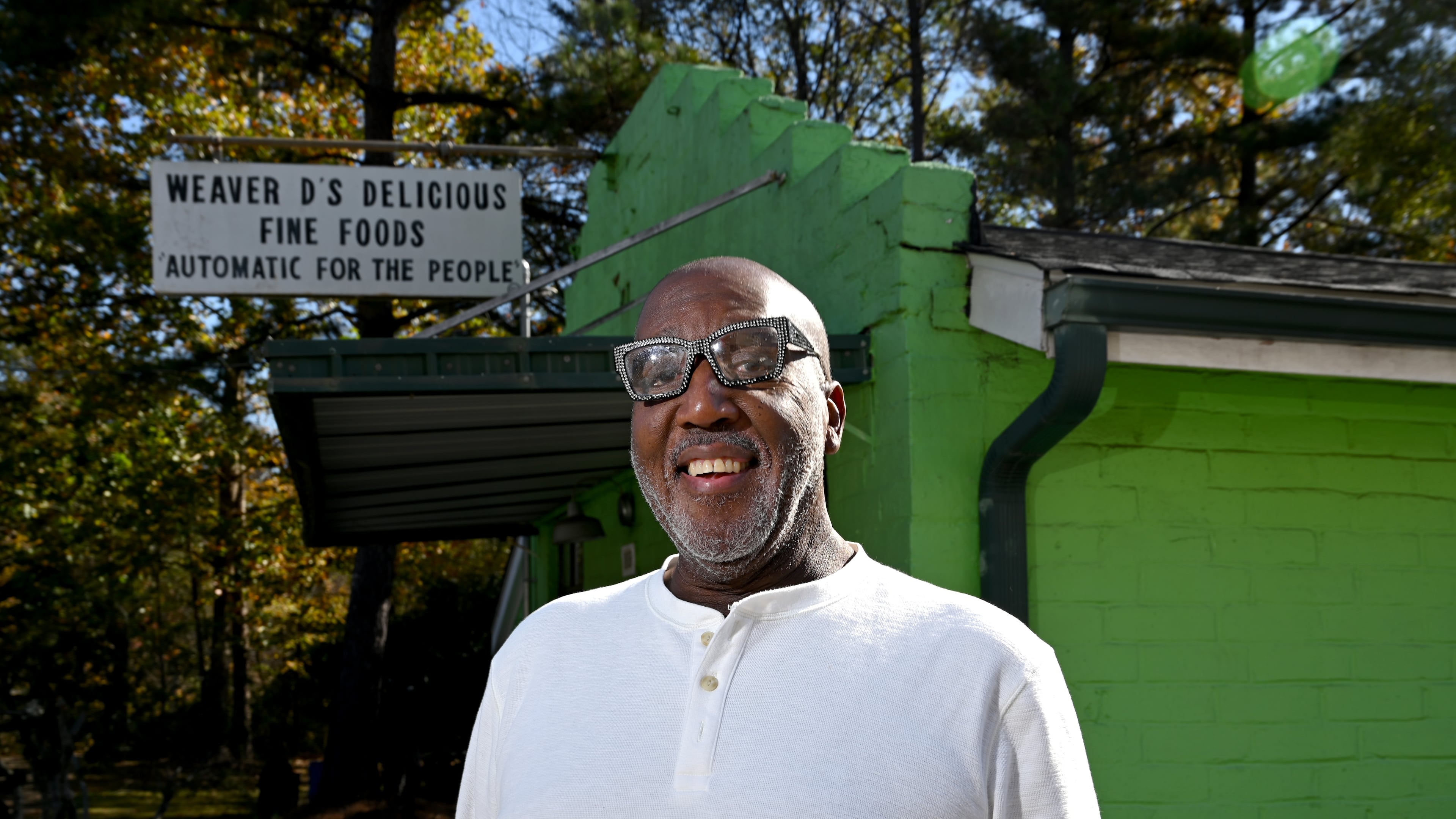 Dexter Weaver, owner of Weaver D’s Delicious Fine Foods, stands outside his restaurant on Wednesday, Nov. 12, 2025. Weaver has put the iconic Athens eatery up for sale, 39 years after he opened it. (Hyosub Shin/AJC)