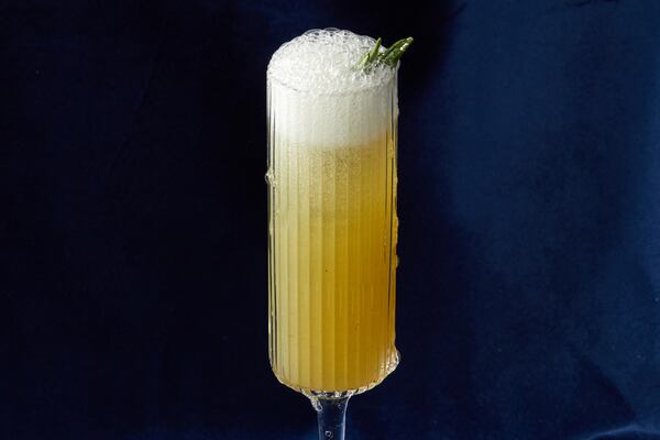 Charred Lemon and Rosemary Gin Sparkler. (Prop styling by Morgan Locke, food styling by Kate Williams / Bailey Garrot for The Atlanta Journal-Constitution.)