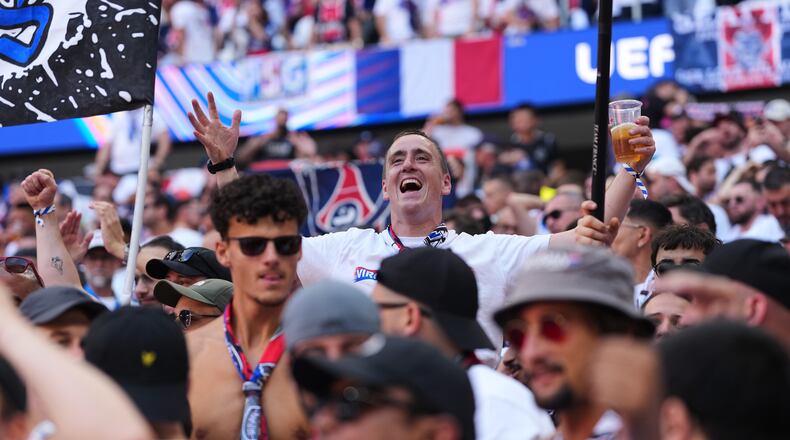 FILE - PSG fans cheer for their team before the Champions League final soccer match between Paris Saint-Germain and Arsenal in Budapest, Hungary, May 30, 2026. (AP Photo/Andreea Alexandru, File)