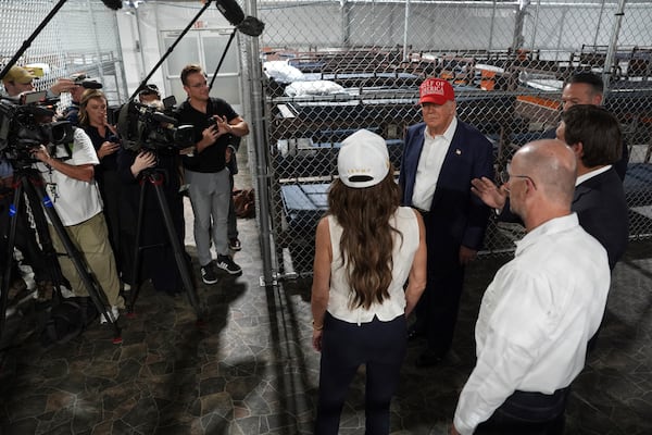 President Donald Trump, Gov. Ron DeSantis, R-Fla., and Homeland Security Secretary Kristi Noem, and others, tour "Alligator Alcatraz," a new migrant detention facility at Dade-Collier Training and Transition facility, Tuesday, July 1, 2025, in Ochopee, Fla. (AP Photo/Evan Vucci)
