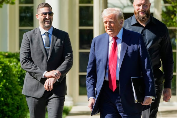President Donald Trump arrives with head coach Nick Sirianni, left, to welcome the Super Bowl champion Philadelphia Eagles NFL football team to the South Lawn of the White House, Monday, April 28, 2025, in Washington. (AP Photo/Mark Schiefelbein)