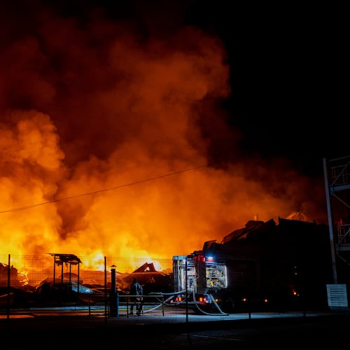 Firefighters put out a fire after Russian missiles hit a warehouse in Kyiv, Ukraine, Wednesday, Aug. 5, 2026. (AP Photo/Dan Bashakov)