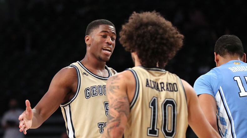 123020 ATLANTA: Georgia Tech forward Moses Wright (left) guard Jose Alvarado celebrate a come from behind 72-67 victory over North Carolina in a NCAA college basketball game on Wednesday, Dec. 30, 2020, in Atlanta. pool photo Curtis Compton / Curtis.Compton@ajc.com”
