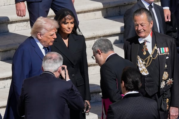 President Donald Trump, left, and first lady Melania Trump arrive for the funeral of Pope Francis in St. Peter's Square at the Vatican, Saturday, April 26, 2025. (AP Photo/Gregorio Borgia)
