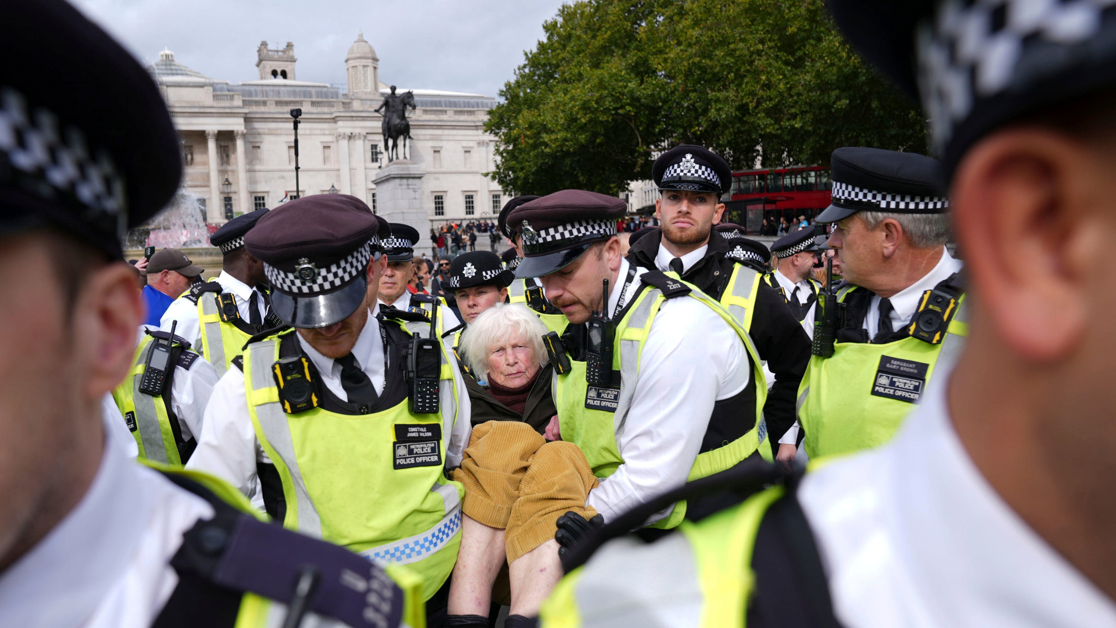 Police remove a protester taking part in a demonstration organised by Defend our Juries, in support of Palestine Action in Trafalgar Square, London Saturday Oct. 4, 2025. (Maja Smiejkowska/PA via AP)