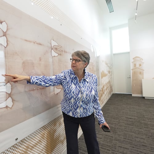 Nora Creech, director of Othonia North America, points to a replica of the Shroud of Turin at a new interactive museum dedicated to the shroud, Monday, Nov. 17, 2025, at the Christ Cathedral campus in Garden Grove, Calif. (AP Photo/Krysta Fauria)