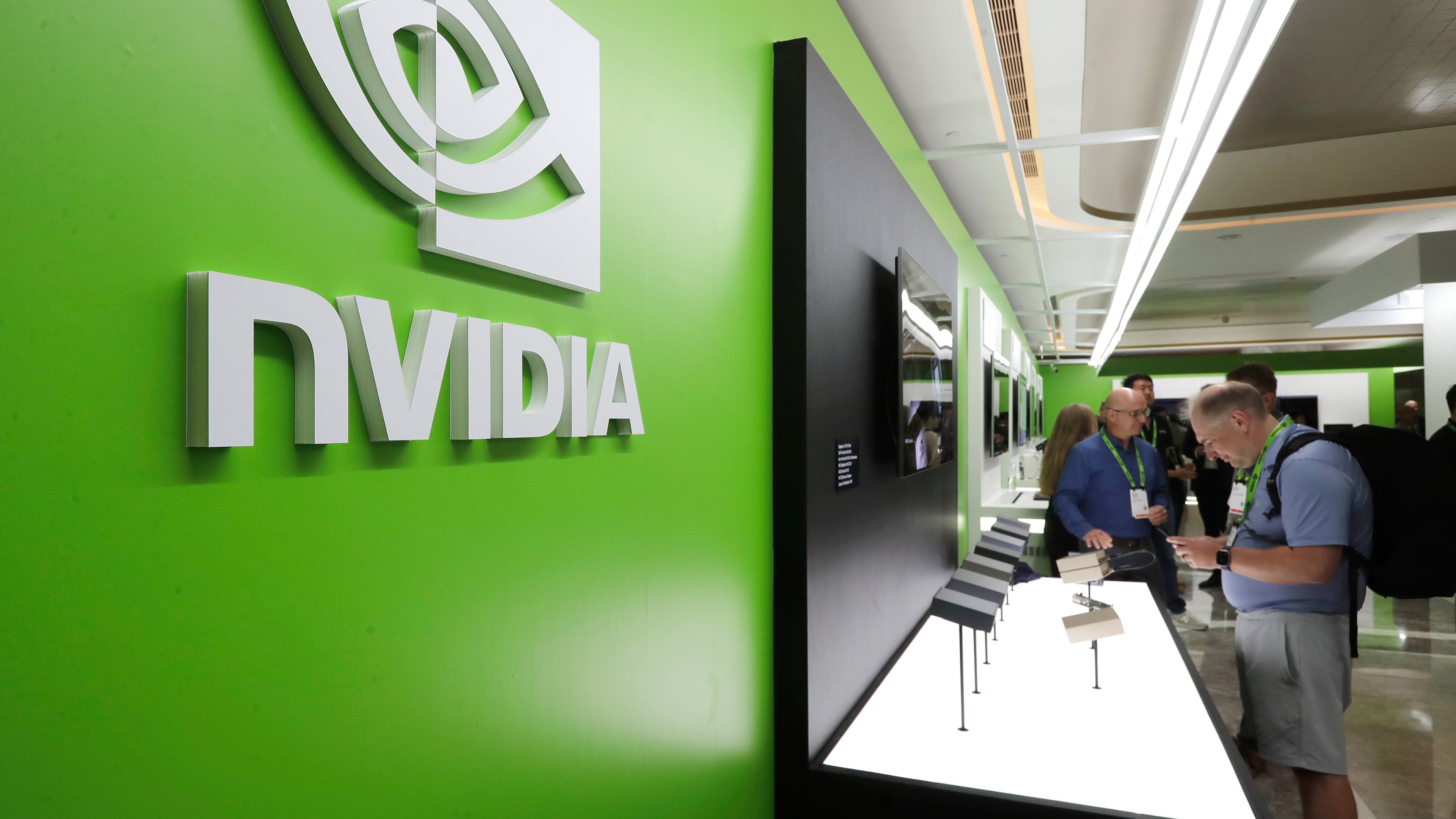 FILE - People take a look to Nvidia''s new products during the Computex 2025 exhibition in Taipei, Taiwan, Wednesday, May 21, 2025. (AP Photo/Chiang Ying-ying, File)