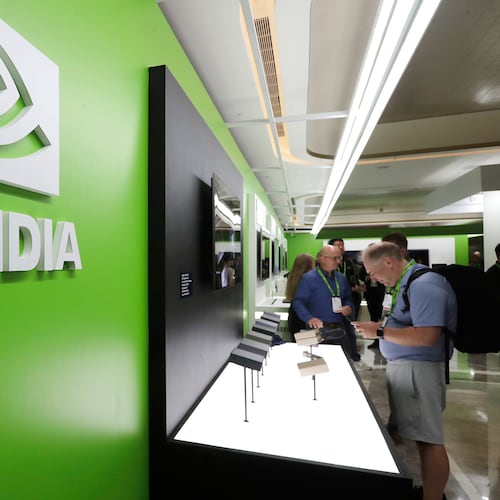 FILE - People take a look to Nvidia''s new products during the Computex 2025 exhibition in Taipei, Taiwan, Wednesday, May 21, 2025. (AP Photo/Chiang Ying-ying, File)