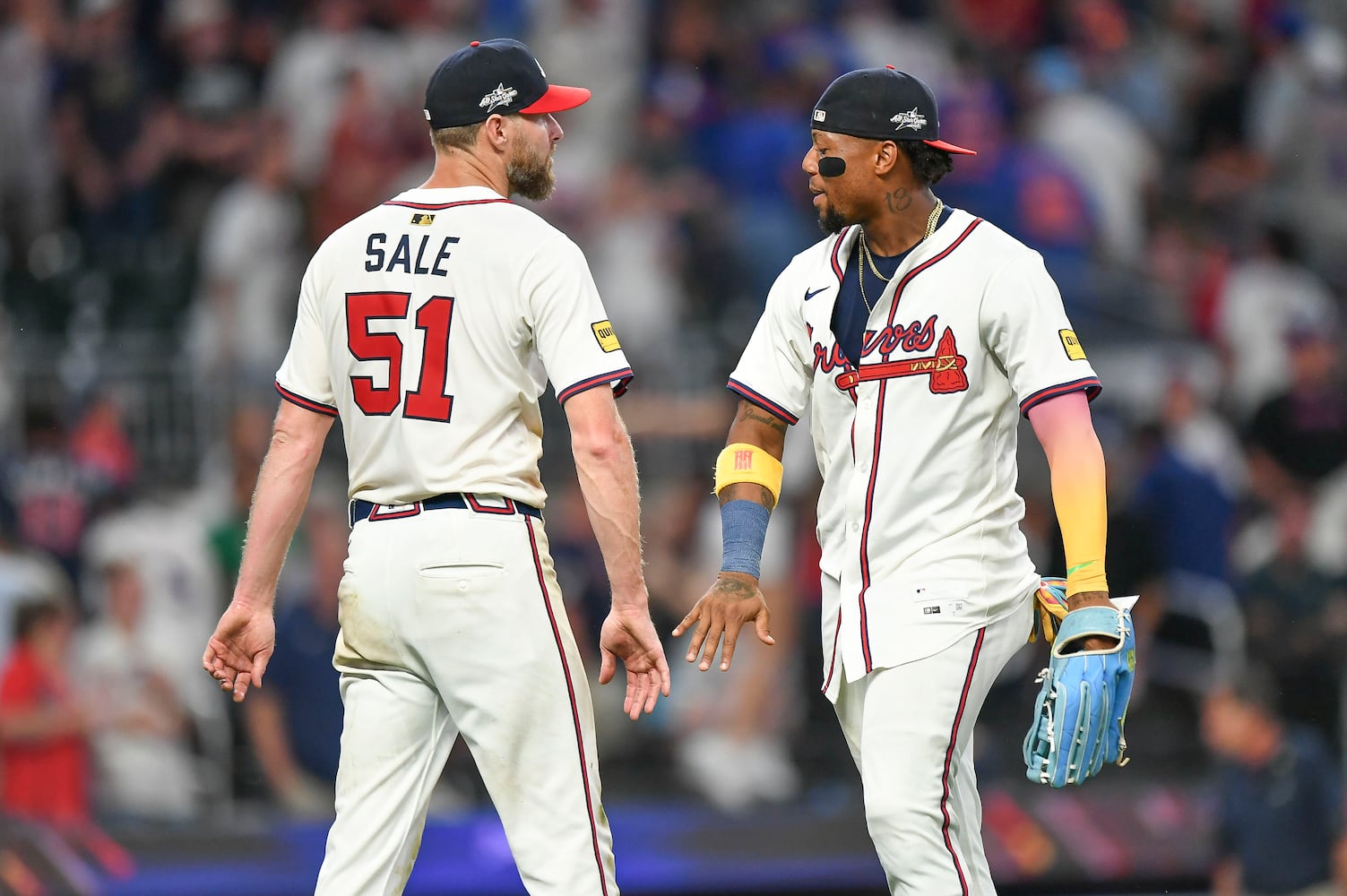 Atlanta Braves pitcher Chris Sale (51) and outfielder Ronald Acuña Jr. (13) celebrate their 5-0 win over the New York Mets during a MLB game Wednesday, June 18, 2025 at Truist Park. (Daniel Varnado/For the Atlanta Journal-Constitution)