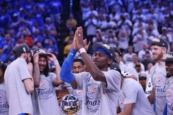 Oklahoma City Thunder guard Shai Gilgeous-Alexander (2), front, celebrates with teammates after Game 5 of the Western Conference finals of the NBA basketball playoffs against the Minnesota Timberwolves, Wednesday, May 28, 2025, in Oklahoma City. (AP Photo/Nate Billings)