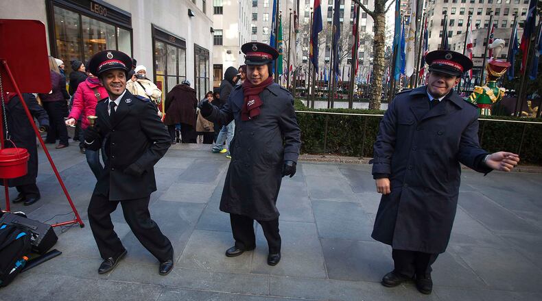 Salvation Army members sing to shoppers at Rockefeller Center in New York.