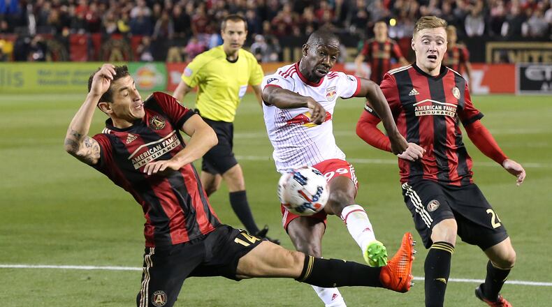 March 5, 2017, Atlanta: Atlanta United RC Carlos Carmona canât block a shot by N.Y. Red Bulls Bradley Wright-Phillips during the second half in the first game in franchise history on Sunday, March 5, 2017, in Atlanta. Wright-Phillips scored the winning goal to defeat the Atlanta United RC 2-1. Curtis Compton/ccompton@ajc.com