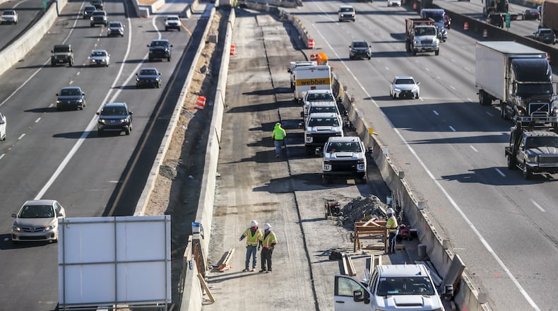 Georgia officials are looking for a long-term way to pay for road construction. Gas tax receipts are expected to decline in coming decades as fuel efficiency increases and more people drive electric vehicles. (File photo by John Spink / John.Spink@ajc.com)