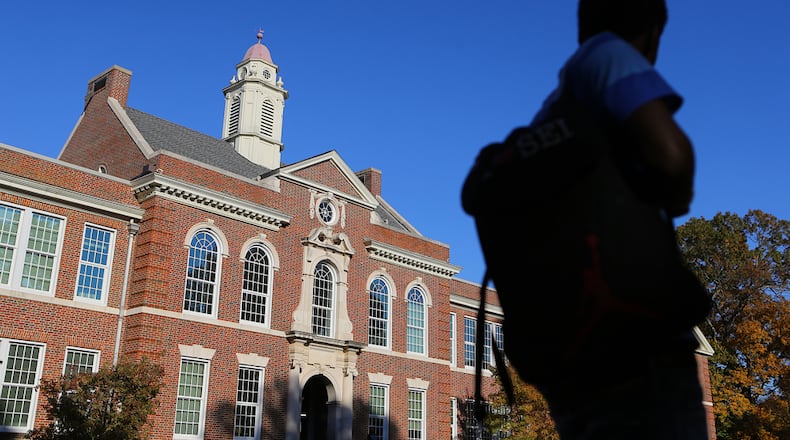 A student heads home after school at Druid Hills High School on Tuesday, Nov. 11, 2014, in Atlanta. The school, which opened at its current location in 1928, is in need of upgrades. (AJC 2014)