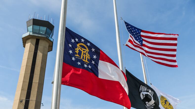 Flags were at half-staff at DeKalb-Peachtree Airport on Mon., May 16, 2016, after a deadly crash at the Good Neighbor Day Air Show. JOHN SPINK / JSPINK@AJC.COM