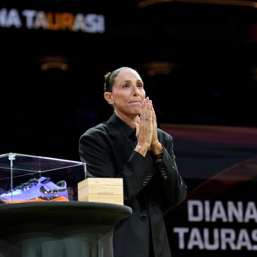 Retired WNBA Phoenix Mercury basketball player Diana Taurasi acknowledges the cheering crowd as she is honored during a halftime Ring of Honor ceremony Sunday, Aug. 16, 2026, in Phoenix. (AP Photo/Ross D. Franklin)