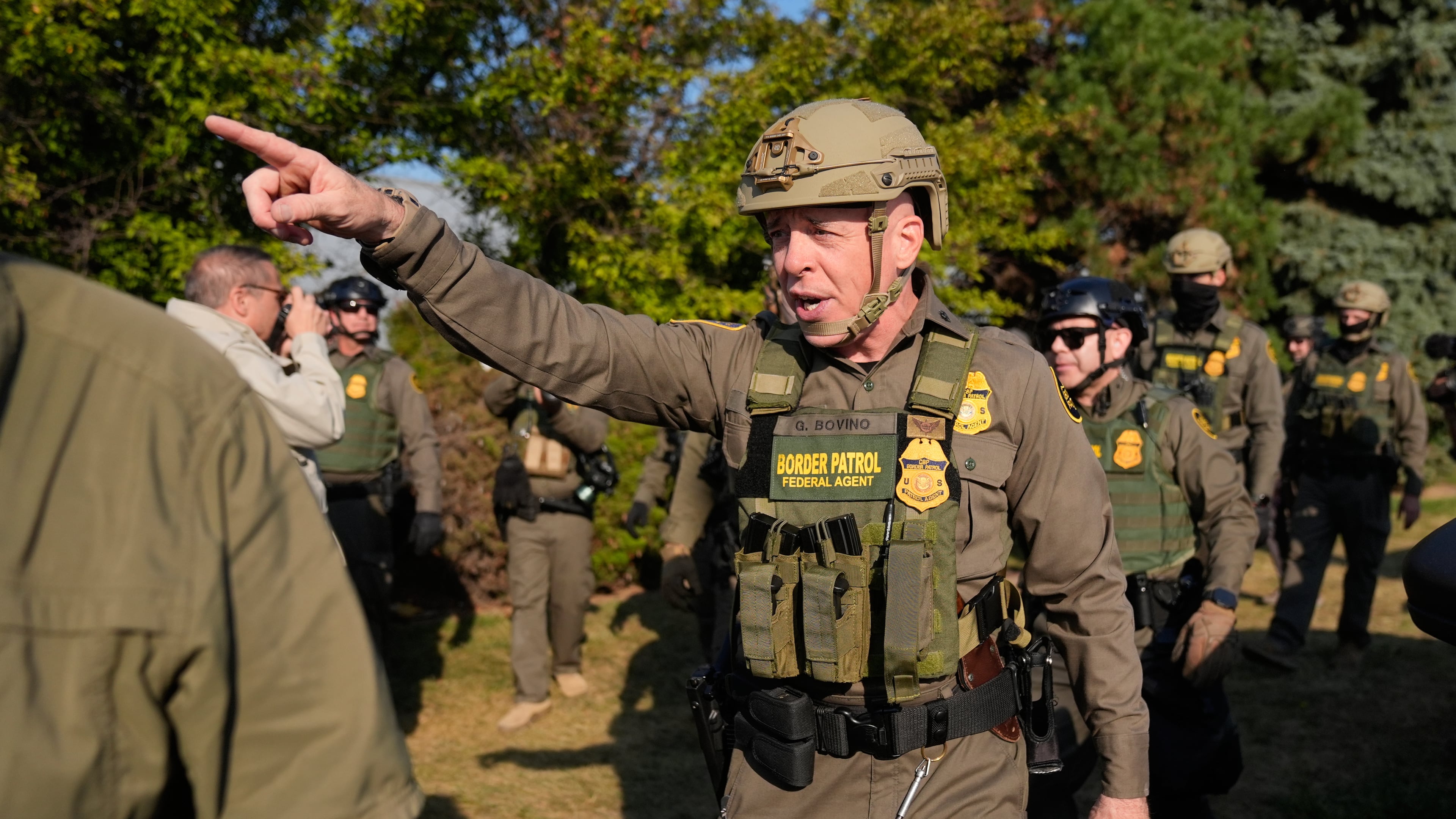 Greg Bovino, the chief patrol agent for the U.S. Border Patrol El Centro sector, center, walks with federal immigration agents near an Immigration and Customs Enforcement facility in Broadview, Ill., Friday, Oct. 3, 2025. (AP Photo/Erin Hooley)