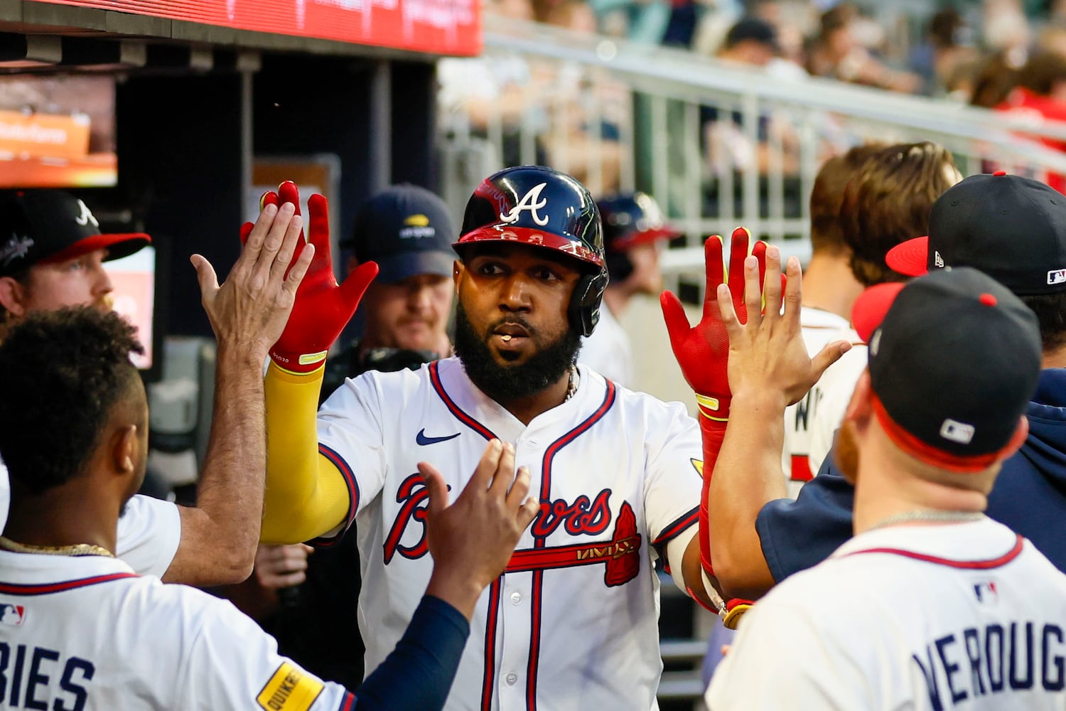 Atlanta Braves designated hitter Marcell Ozuna (20) celebrates with teammates at the dug out after scoring his team’s third run during the fifth inning against the Washington Nationals on Monday, May 12, 2025, in Atlanta.  
(Miguel Martinez/ AJC)
