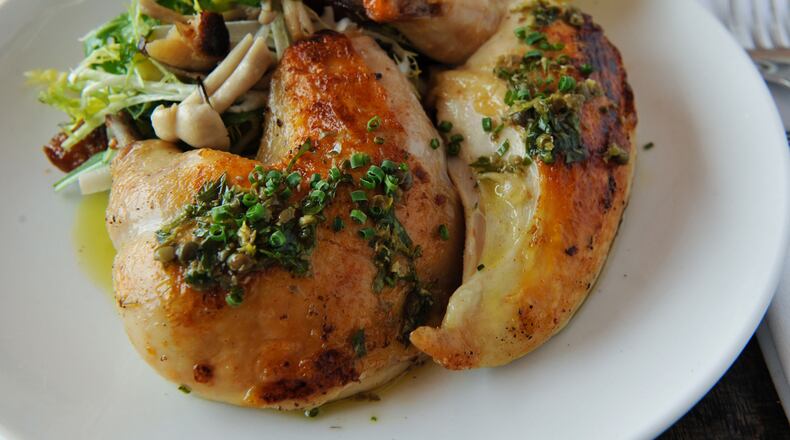 140501-ROSWELL-GA- Jenny Turknett's dine review of Foundation Social Eatery in Roswell on Thursday May 1, 2014. FOOD: Wood Oven Roasted Chicken- roasted vegetable salad, caper gremolata, roasted chicken jus, lemon GF. (BECKYSTEINPHOTOGRAPHY.COM)