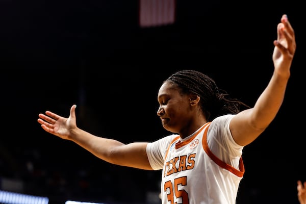 Texas forward Madison Booker reacts after making a three-pointer against TCU during the second half in the Elite Eight of the NCAA college basketball tournament, Monday, March 31, 2025, in Birmingham, Ala. (AP Photo/Butch Dill)