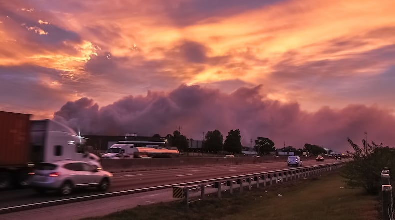 A large plume caused by a chemical reaction was still visible over the BioLab facility in Conyers, where a fire broke out Sunday.