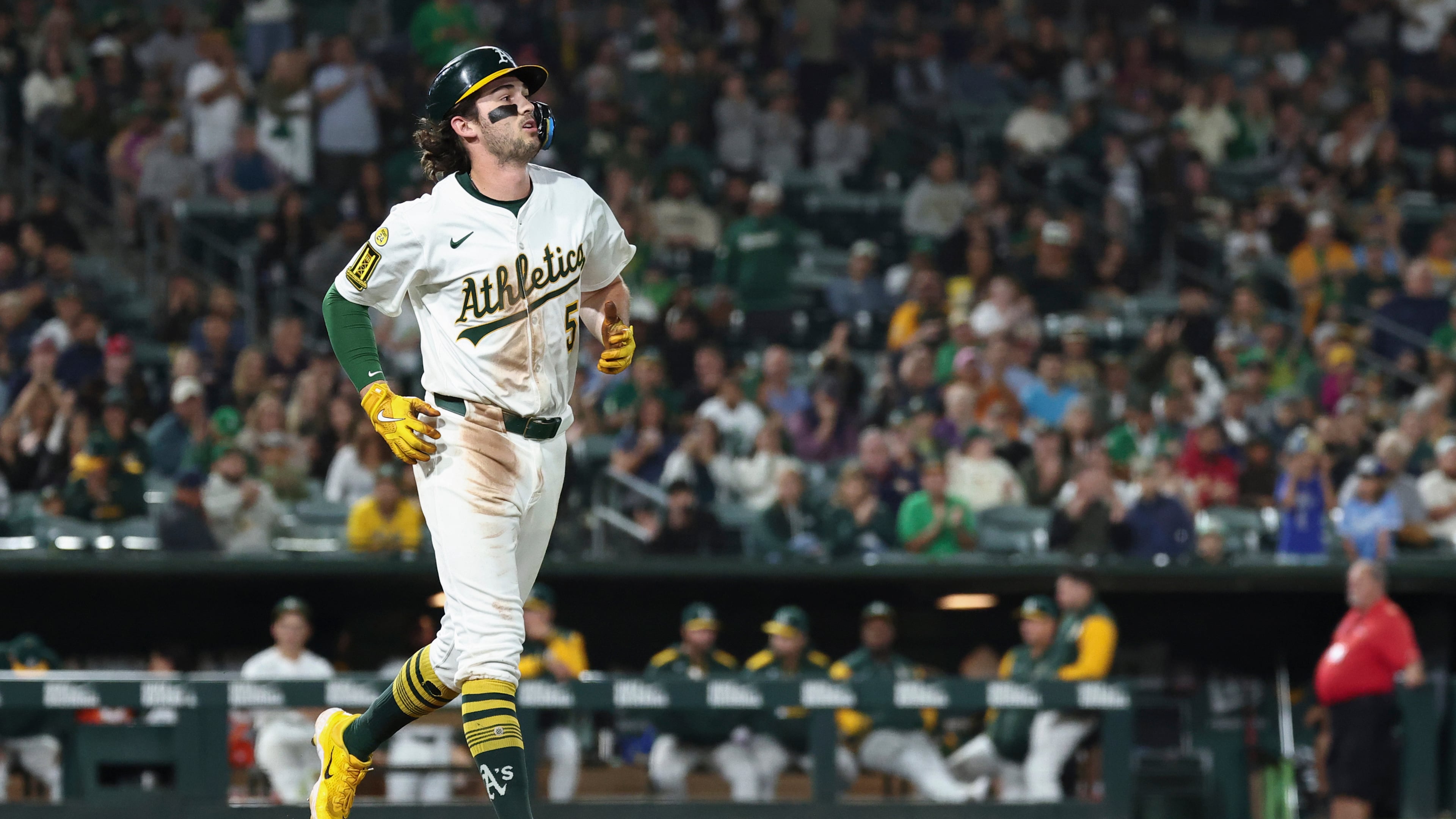 Athletics' Jacob Wilson takes first base after getting hit by a pitch from Kansas City Royals pitcher Carlos Estévez, not shown, during the ninth inning of a baseball game Saturday, Sept. 27, 2025, in West Sacramento, Calif. (AP Photo/Sara Nevis)