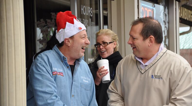 Paul Letalien shares a light moment with Captain Herb Emory (left) and another Toys for Tots supporter at a Marine Toys for Tots Foundation charity event. The yearly celebration was held at Fred's Bar-B-Q House in Lithia Springs. Captain Herb died in 2014, and the iconic WSB radio traffic reporter's colleagues have carried on his annual Toys for Tots drive this year in his memory. CONTRIBUTED BY PAUL LETALIEN