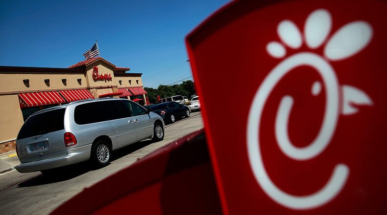 Drive through customers wait in line at a Chick-fil-A restaurant on August 1, 2012 in Fort Worth, Texas.