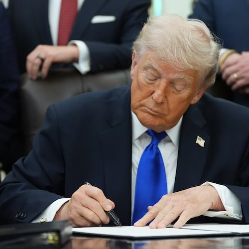 President Donald Trump signs a presidential permit regarding pipeline construction in the Oval Office of the White House, Thursday, April 30, 2026, in Washington. (AP Photo/Alex Brandon)