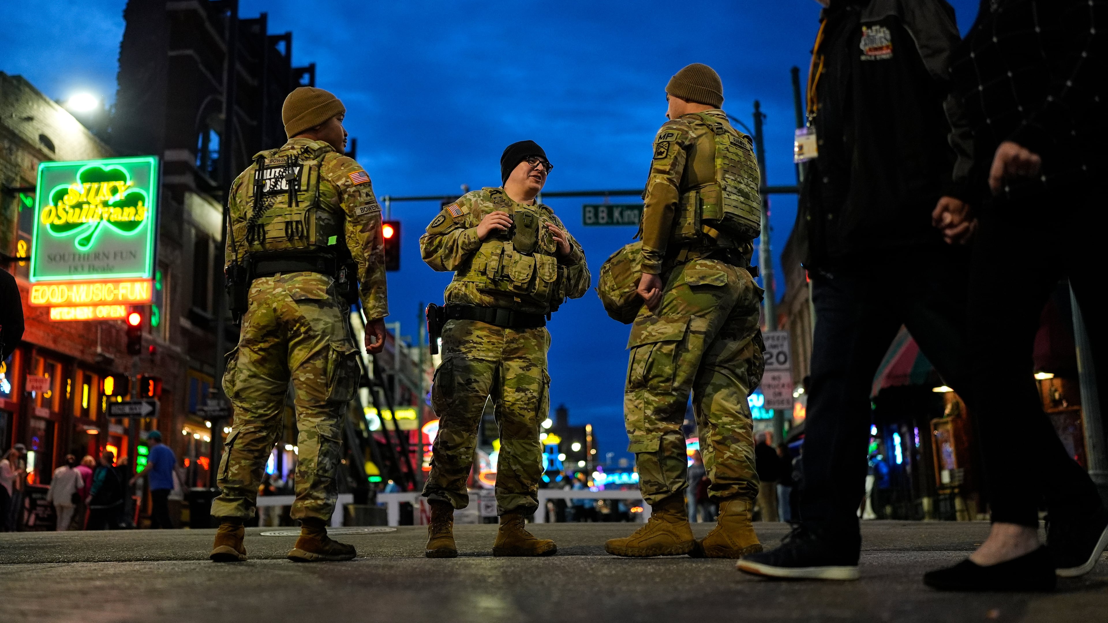 Members of the National Guard stand watch at the intersection of B.B. King Blvd. and Beale Street, Friday, Oct. 24, 2025, in Memphis, Tenn. (AP Photo/George Walker IV)
