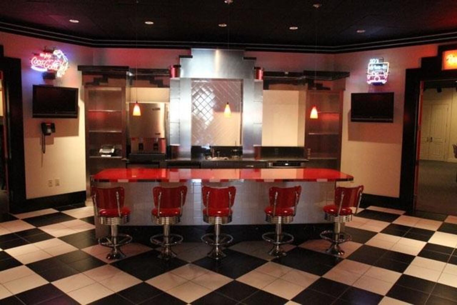 The terrace level of the house also includes a two-lane Brunswick bowling alley, a virtual golf simulator, a '50s diner, an arcade and a impressive train set. The original owner was a former freight train conductor.