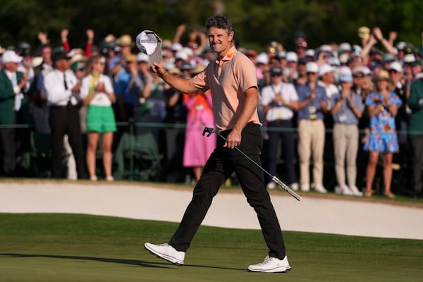 Justin Rose celebrates after a birdie on the 18th hole during the final round at the Masters golf tournament, Sunday, April 13, 2025, in Augusta, Ga. (AP Photo/Matt Slocum)