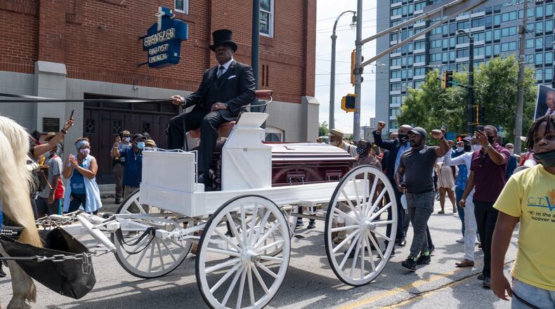 200722-Atlanta-Darrell Watkins drives the caisson carrying C.T. Vivian past the historic Ebenezer Baptist Church during a memorial procession Wednesday afternoon July 22, 2020. Ben Gray for the Atlanta Journal-Constitution