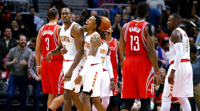 Atlanta Hawks center Dwight Howard (8) reacts after being called for a foul during the first half of an NBA basketball game against the Houston Rockets on Saturday, Nov. 5, 2016, in Atlanta. (AP Photo/Todd Kirkland)